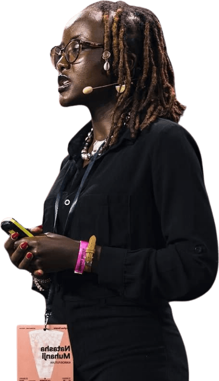 Natasha Muhanji speaking on stage